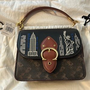 Beat shoulder bag 18 Signature Canvas